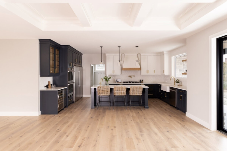 A photo of a modern kitchen with engineered hardwood installed.